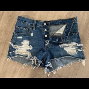 Lightly worn distressed denim shorts